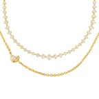 gold and diamond necklace for bridal or evening wear, shown on a dark outfit