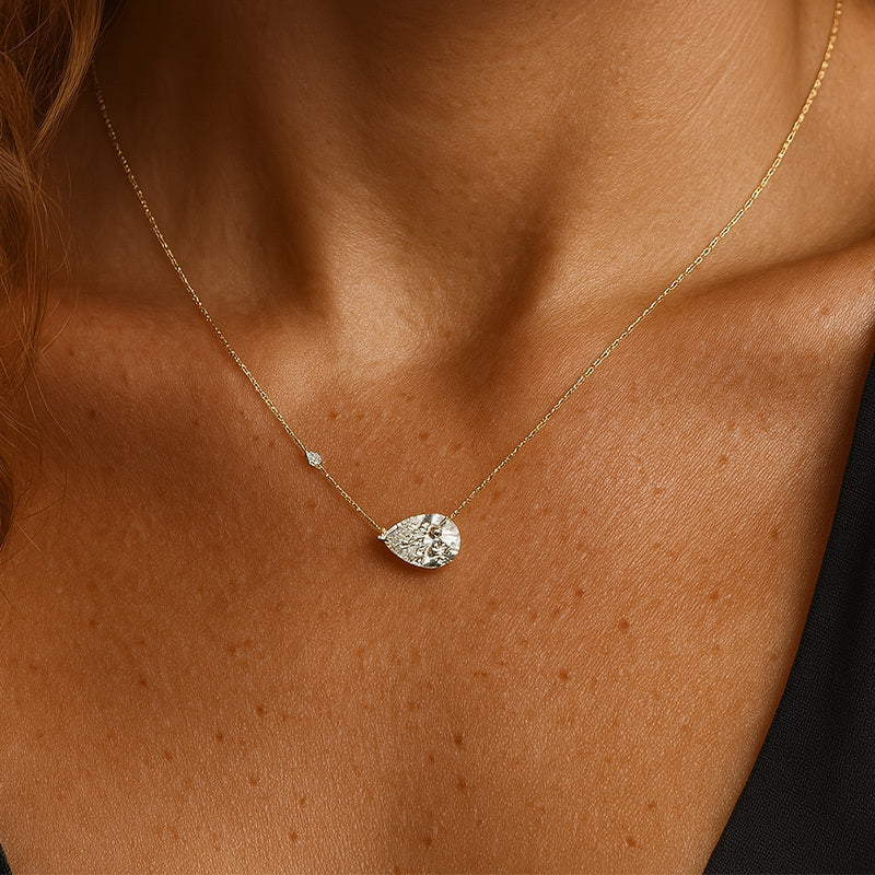 Gold necklace with a teardrop-shaped pendant 