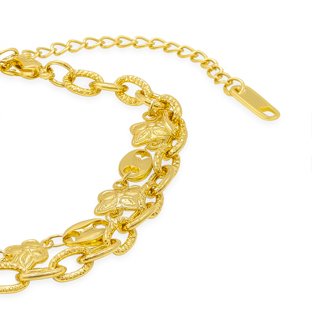 Gold chain bracelet with floral designs 