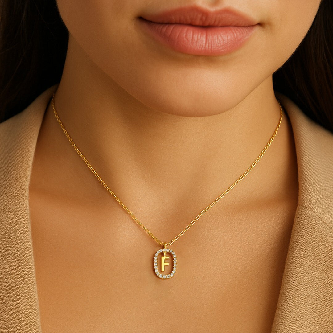 Gold necklace with a 'F' pendant 