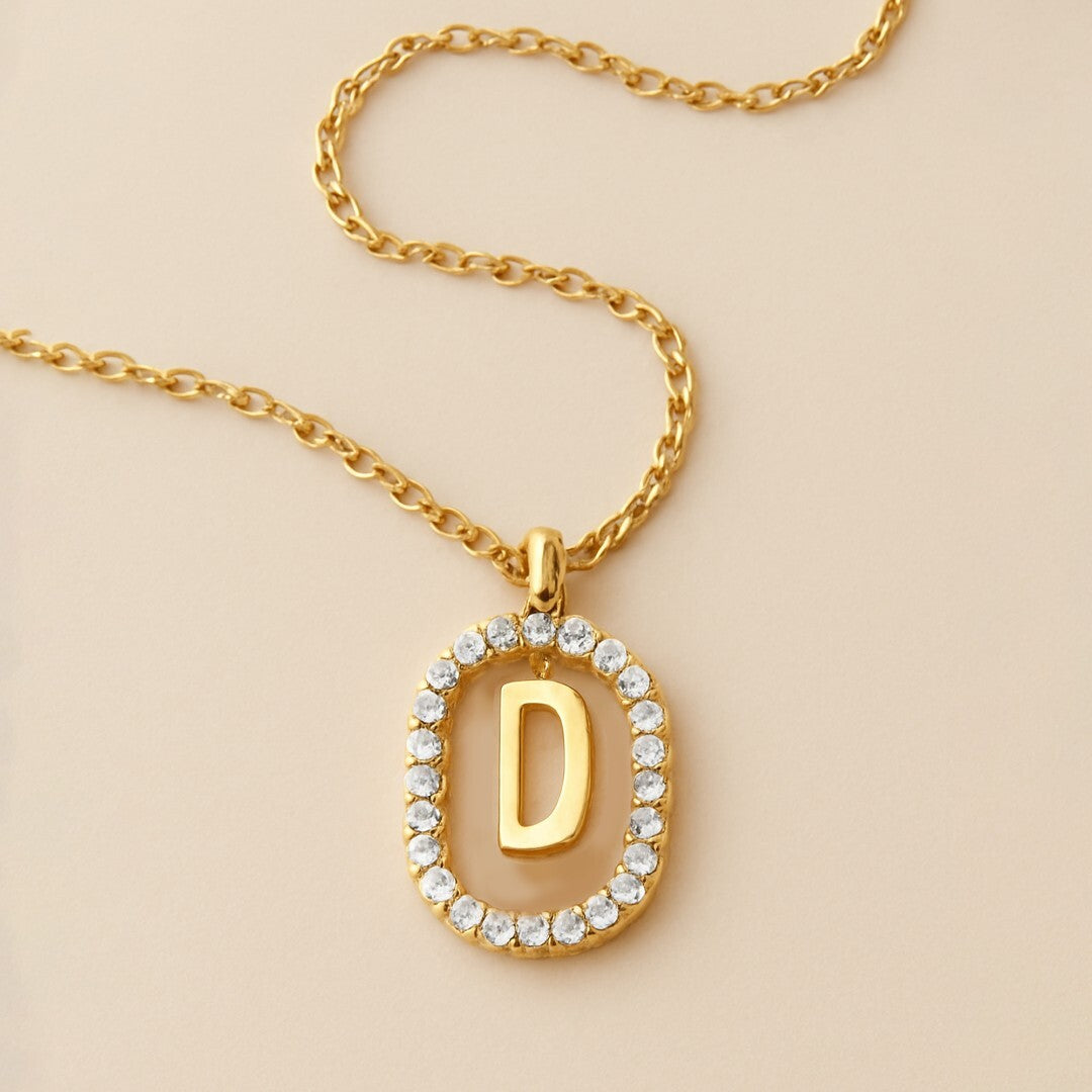 Gold necklace with a pendant  letter 'D' 