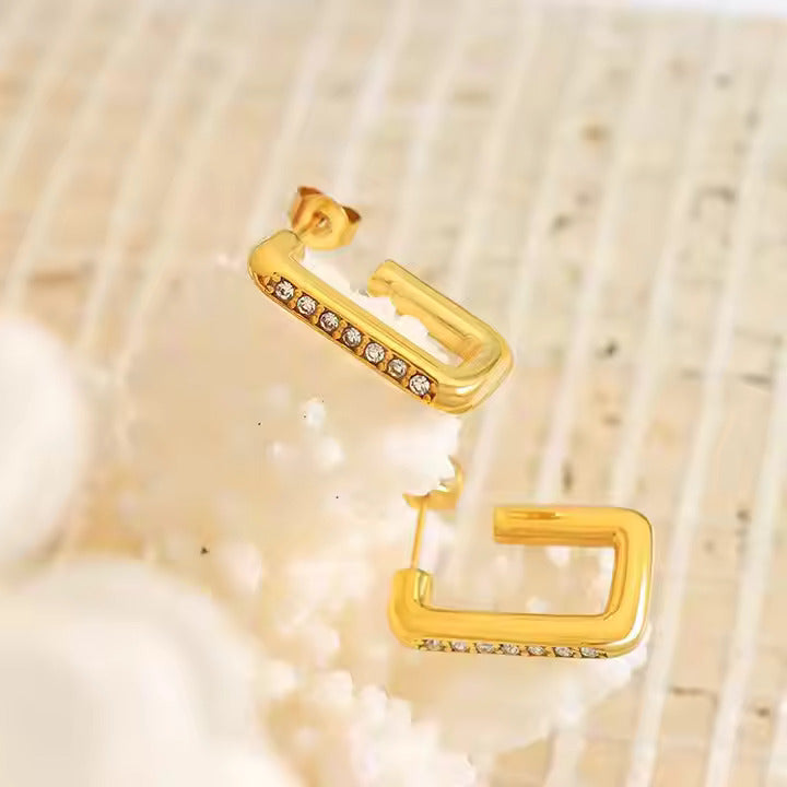 Gold hoop earrings with small diamonds 