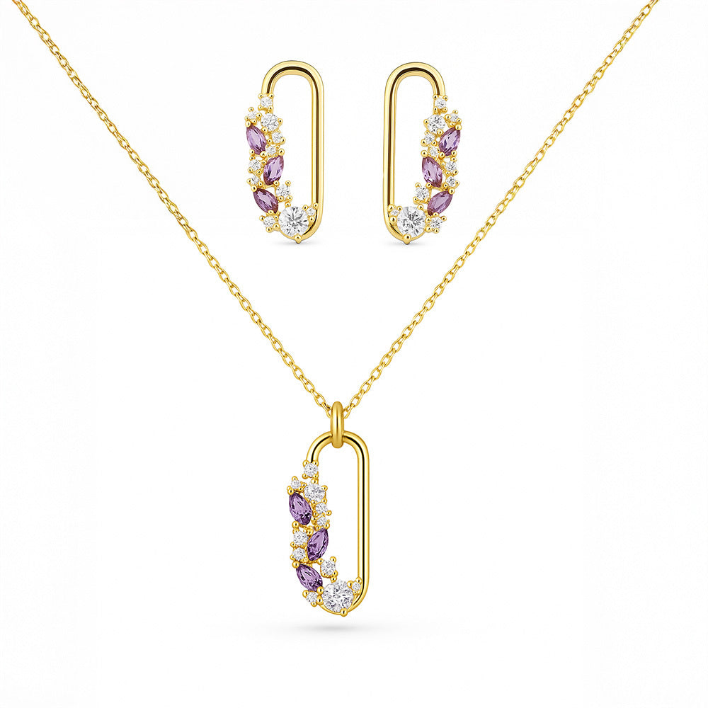 Gold jewelry set with necklace and earrings on a white background