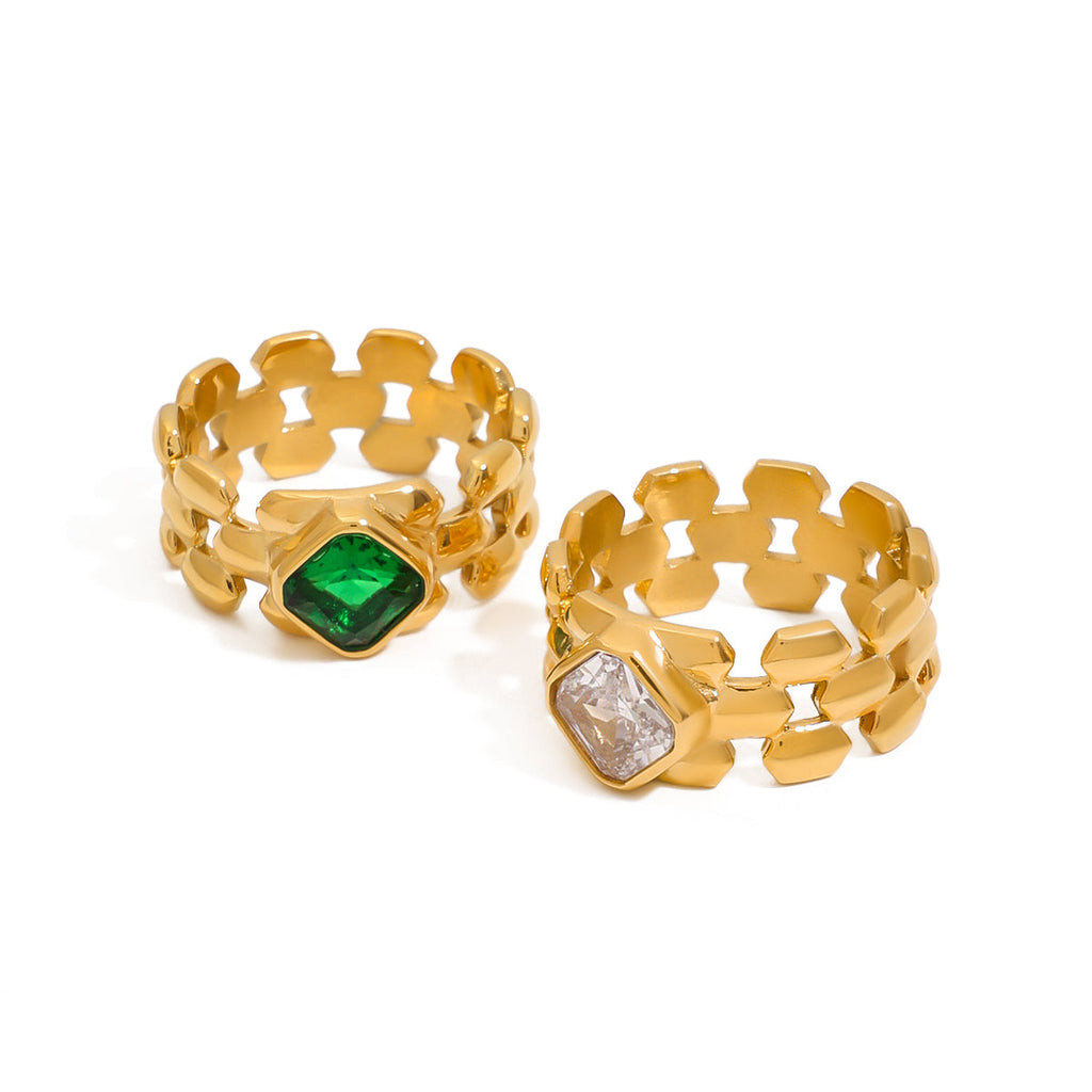 Two gold rings with gemstones]