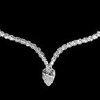 Diamond necklace with a heart-shaped pendant on a black background