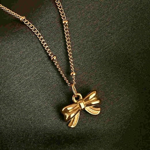Gold bow-shaped pendant necklace 